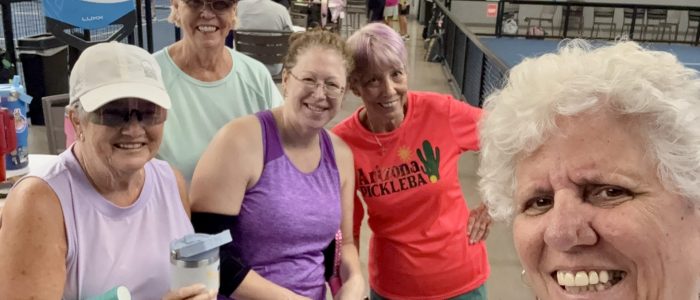 Group of senior female players enjoying friendship